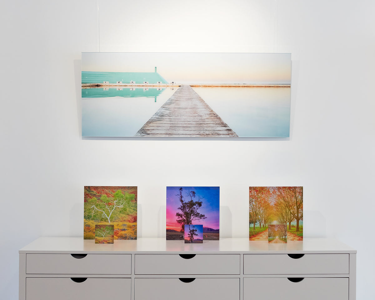 Evening Swim. Newcastle Ocean Baths, frameless acrylic on display in gallery.