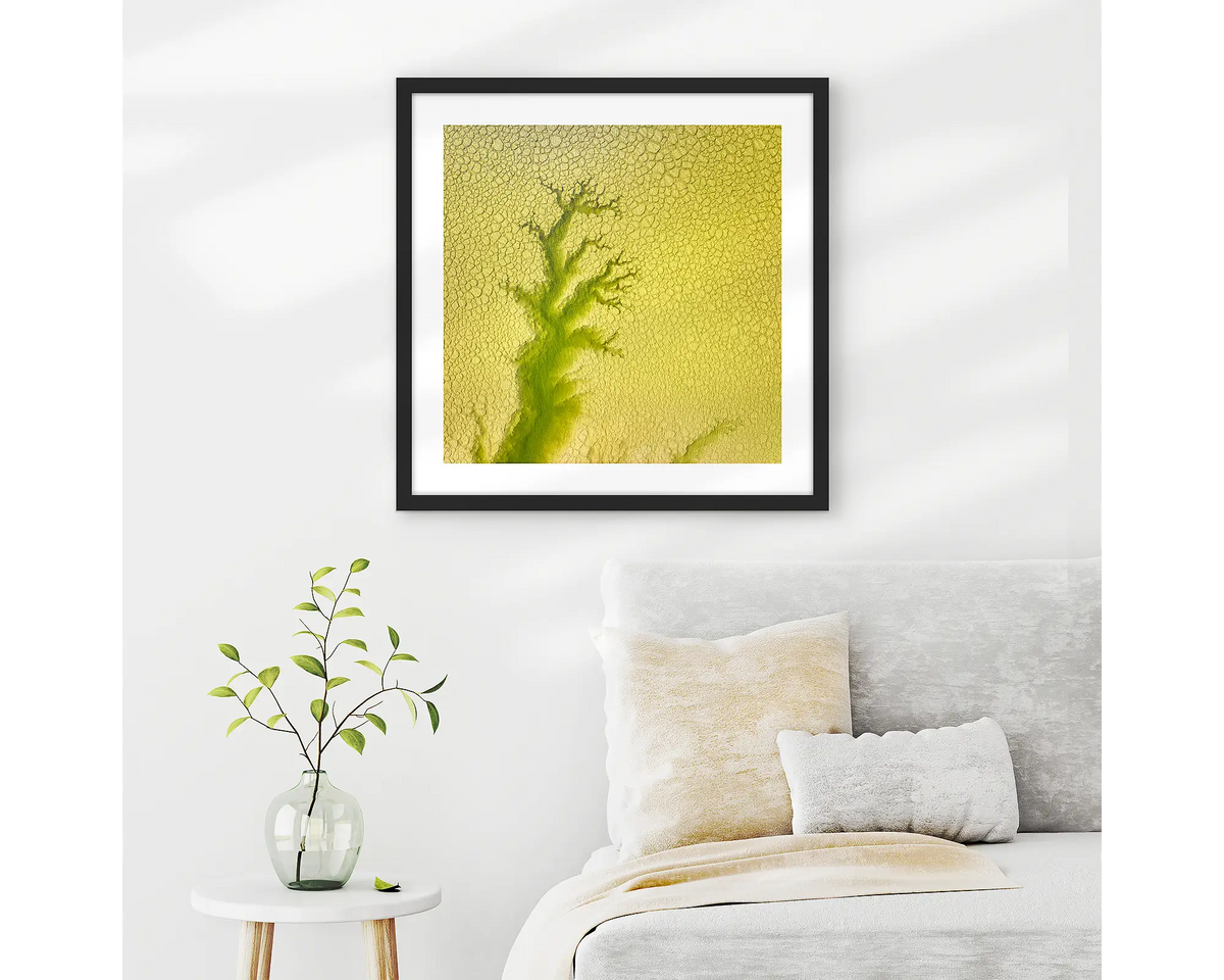 Extend. Aerial abstract, framed wall art print with a black frame, hung on a bedroom wall.