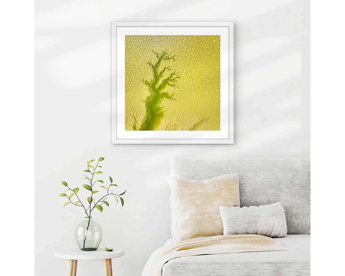 Extend. Aerial abstract, framed wall art print with a white frame, hung on a bedroom wall.