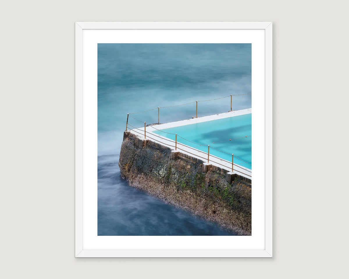 Framed coastal artwork of Bondi Icebergs with an ocean view.