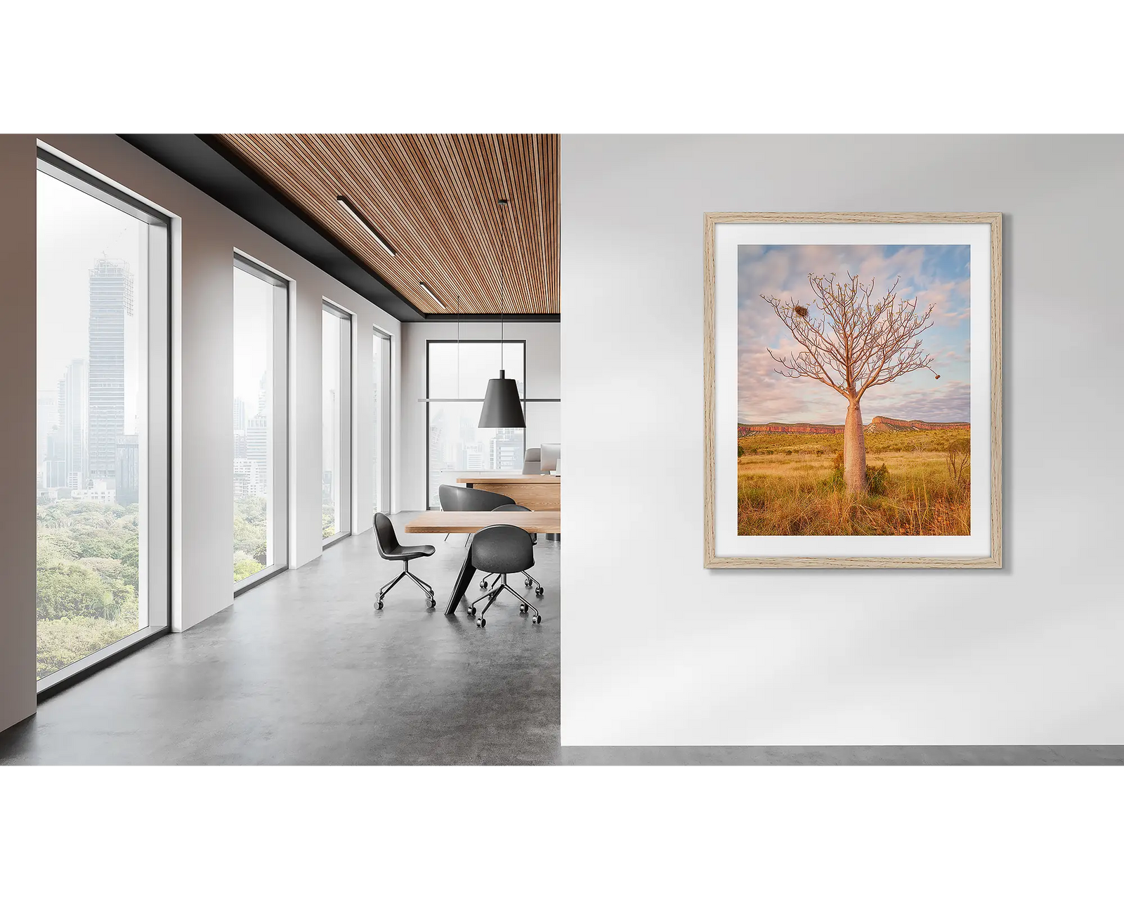 Framed artwork of a boab tree with a birds nest and a berry and the Cockburn Ranges on the horizon. 