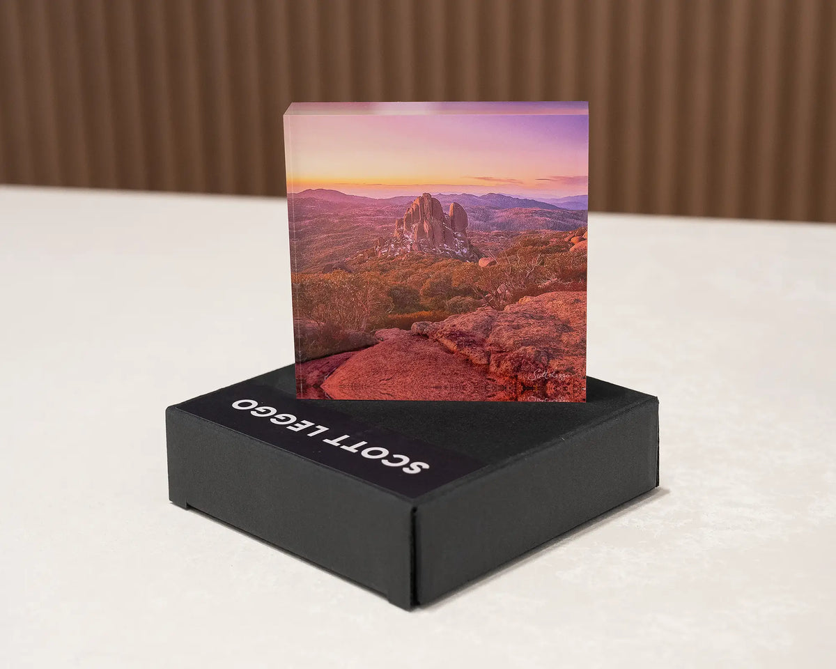 First Snow. Acrylic block of the Cathedral, Mount Buffalo Victoria, placed on a gift box.