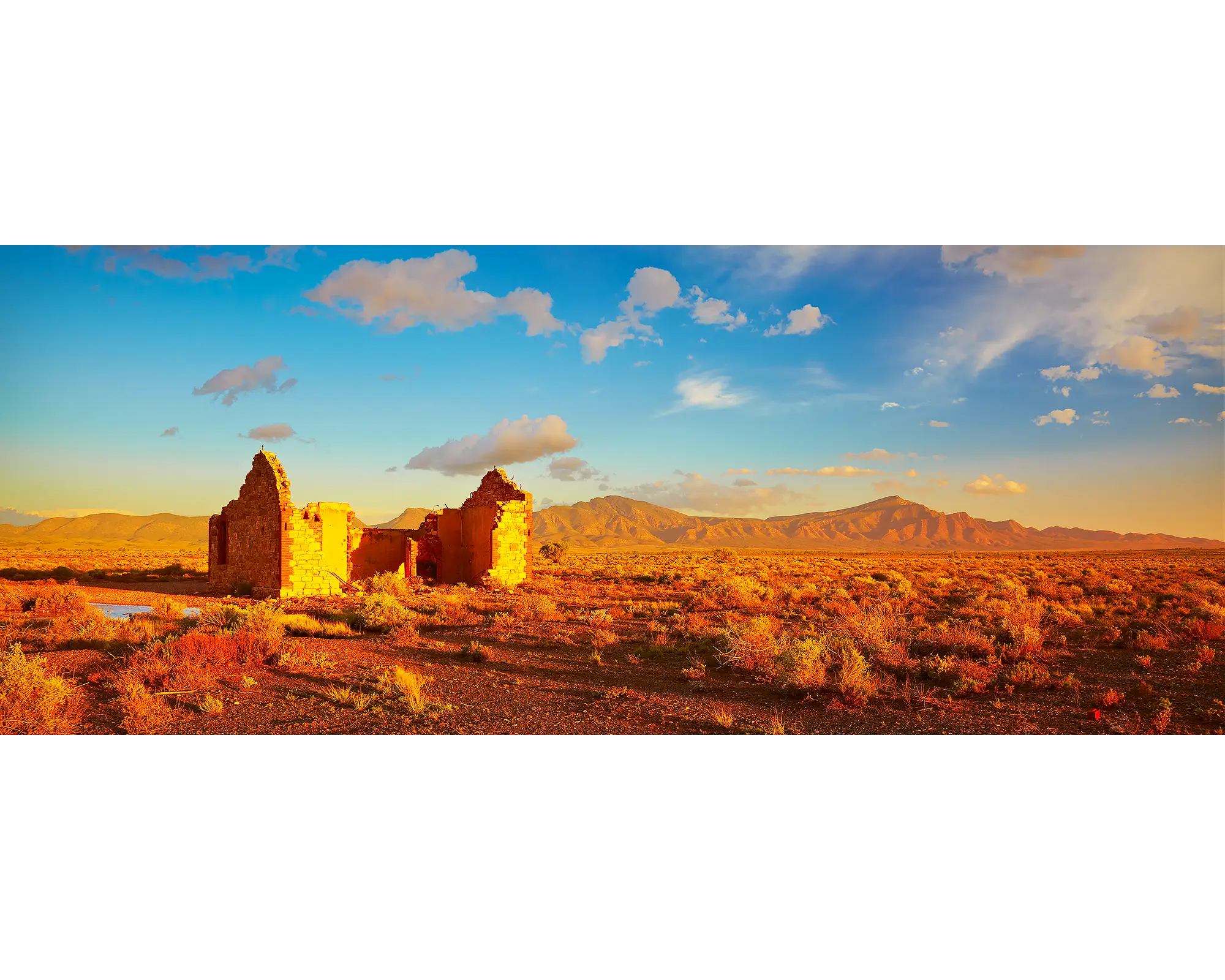 Flinders Ruins - Old farm house with Wilpena Pound in the background, Flinders Ranges.