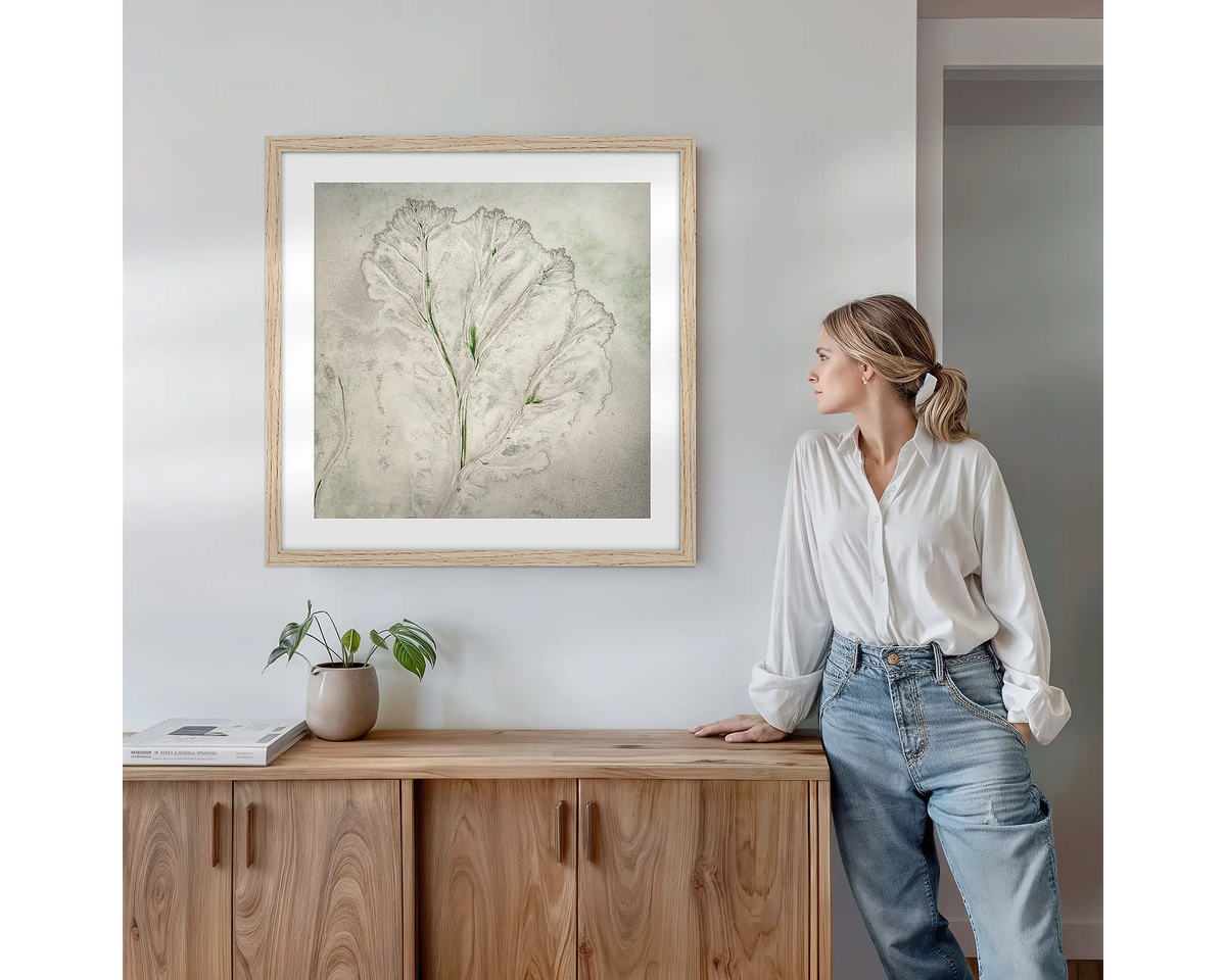 Flourish. Wall art print with timber frame featuring an abstract aerial scene from the Kimberley, hung above a side table.