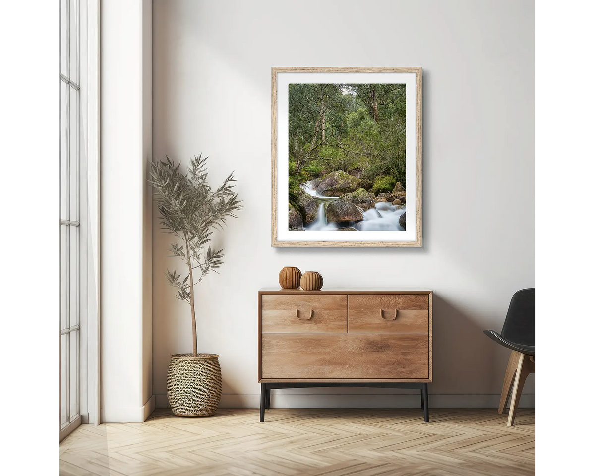 Forest Falls. Mount Buffalo photographic wall art print with a Tassie Oak frame, hung in a scandi hallway. 