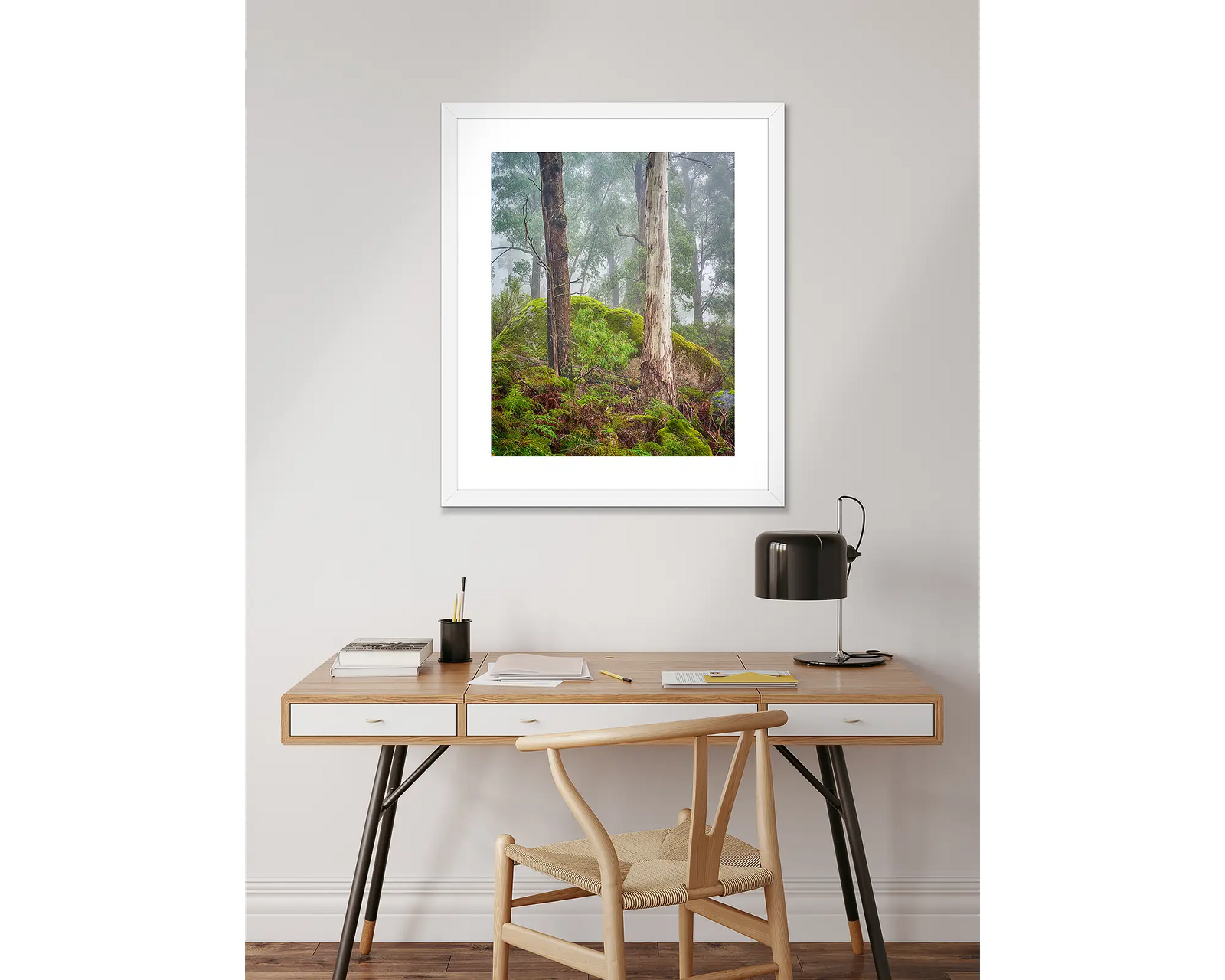 Framed photographic print of a forest scene with tall trees, mossy rocks and foggy atmosphere, on Mount Buffalo. 
