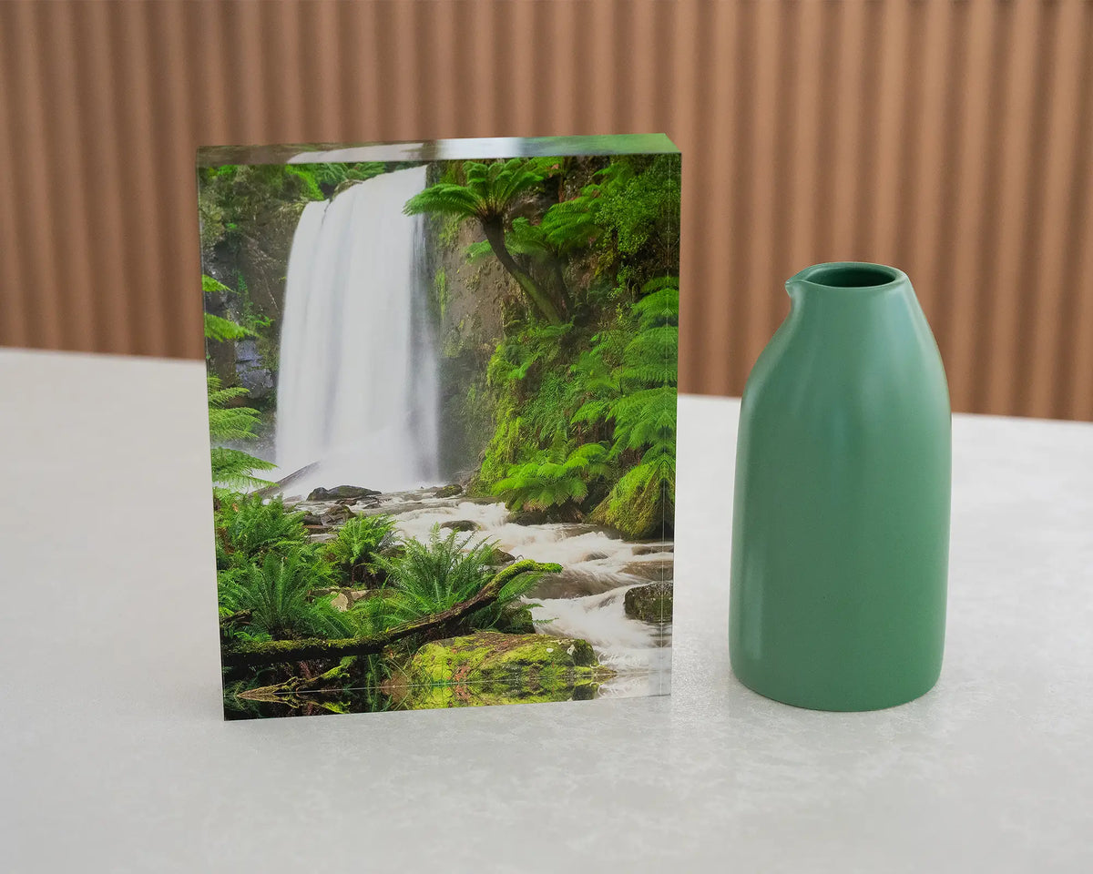 Forest Veil. Acrylic block Hopetoun Falls Victoria, on desk styled with a small vase.