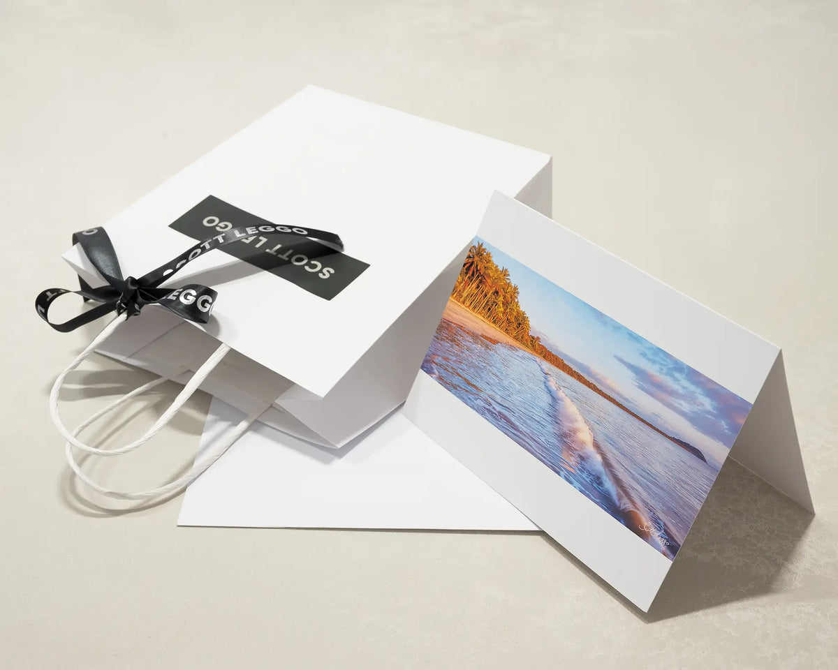 Four Mile Sunrise greeting card of sunrise over Four Mile Beach, Port Douglas, with Scott Leggo gift bag.