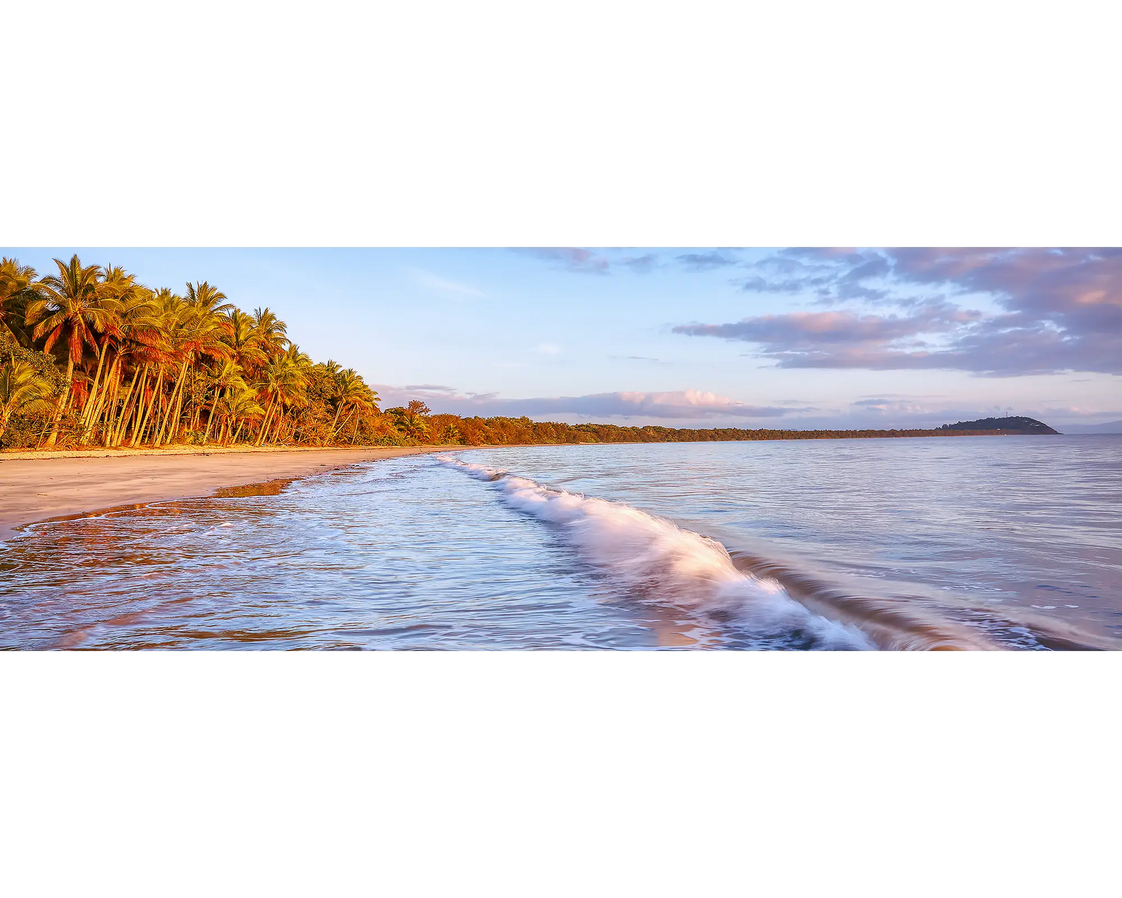 Washes crashing along Four Mile Beach at sunrise, Port Douglas, Queensland, Australia.