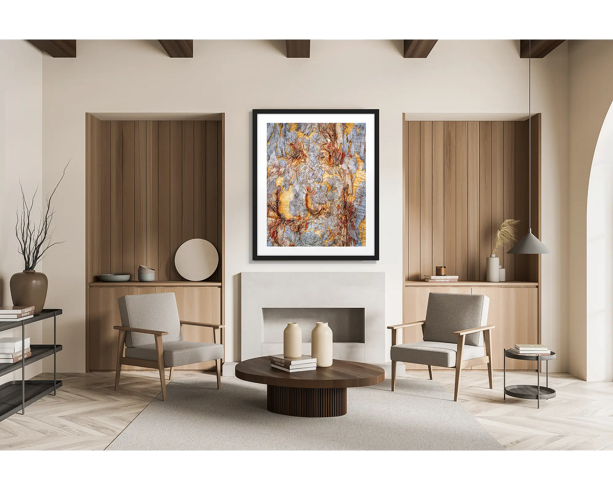 Funny Faces. Abstract wall art print of gum tree bark on Mount Ainslie, Canberra, with a black frame hung in a lounge room. 