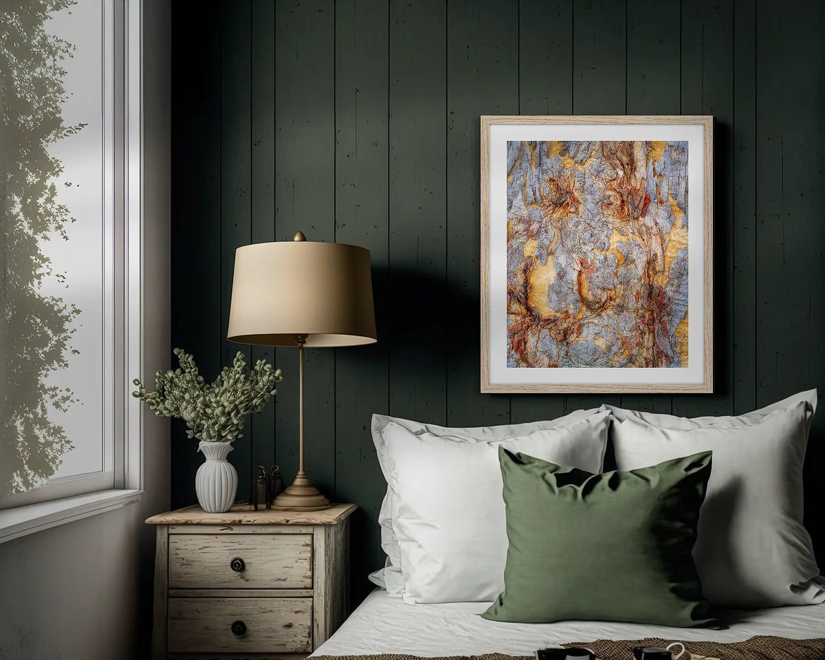 Funny Faces. Abstract wall art print of gum tree bark on Mount Ainslie, with a timber frame hung above a bed. 