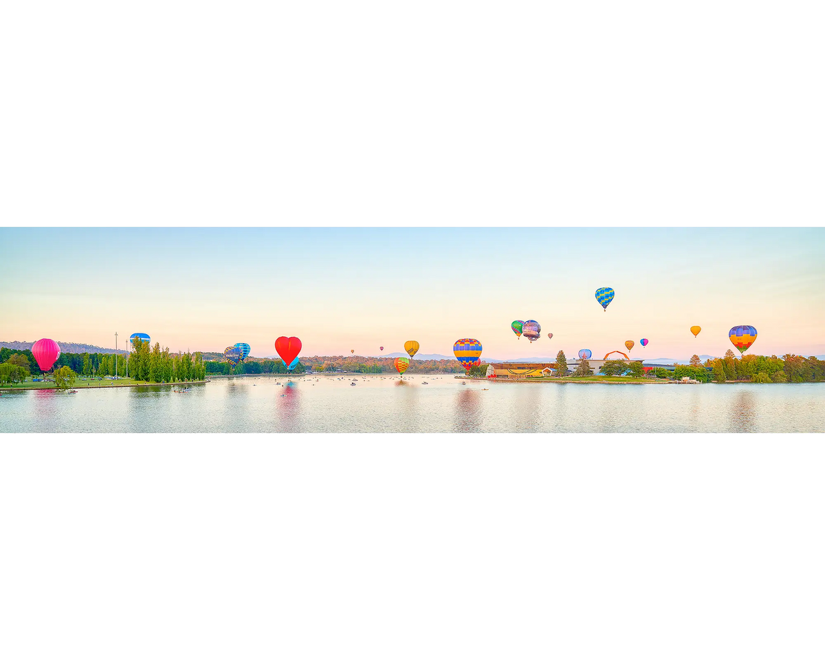 Gathering. Hot air balloons over Lake Burley Griffin, Enlighten festival, Canberra Balloon Spectacular.