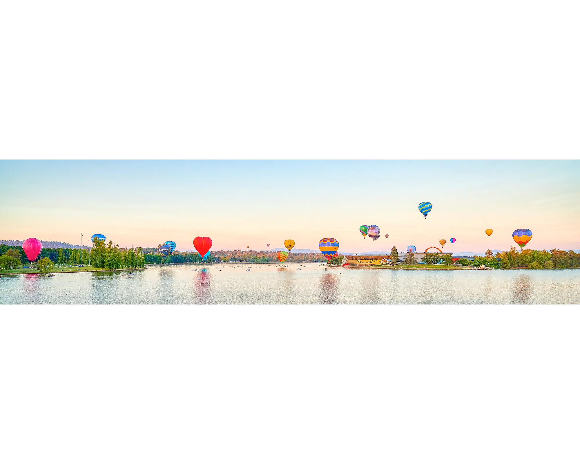Gathering. Hot air balloons over Lake Burley Griffin, Enlighten festival, Canberra Balloon Spectacular.