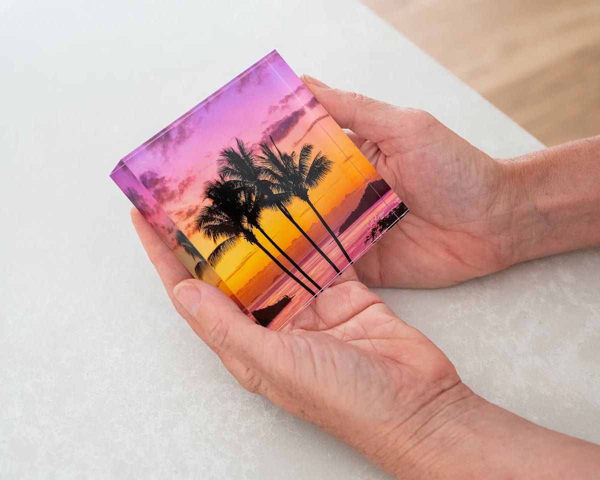 Getaway. 10cm acrylic block of palm trees at sunset, Hamilton Island Queensland, held in hands.