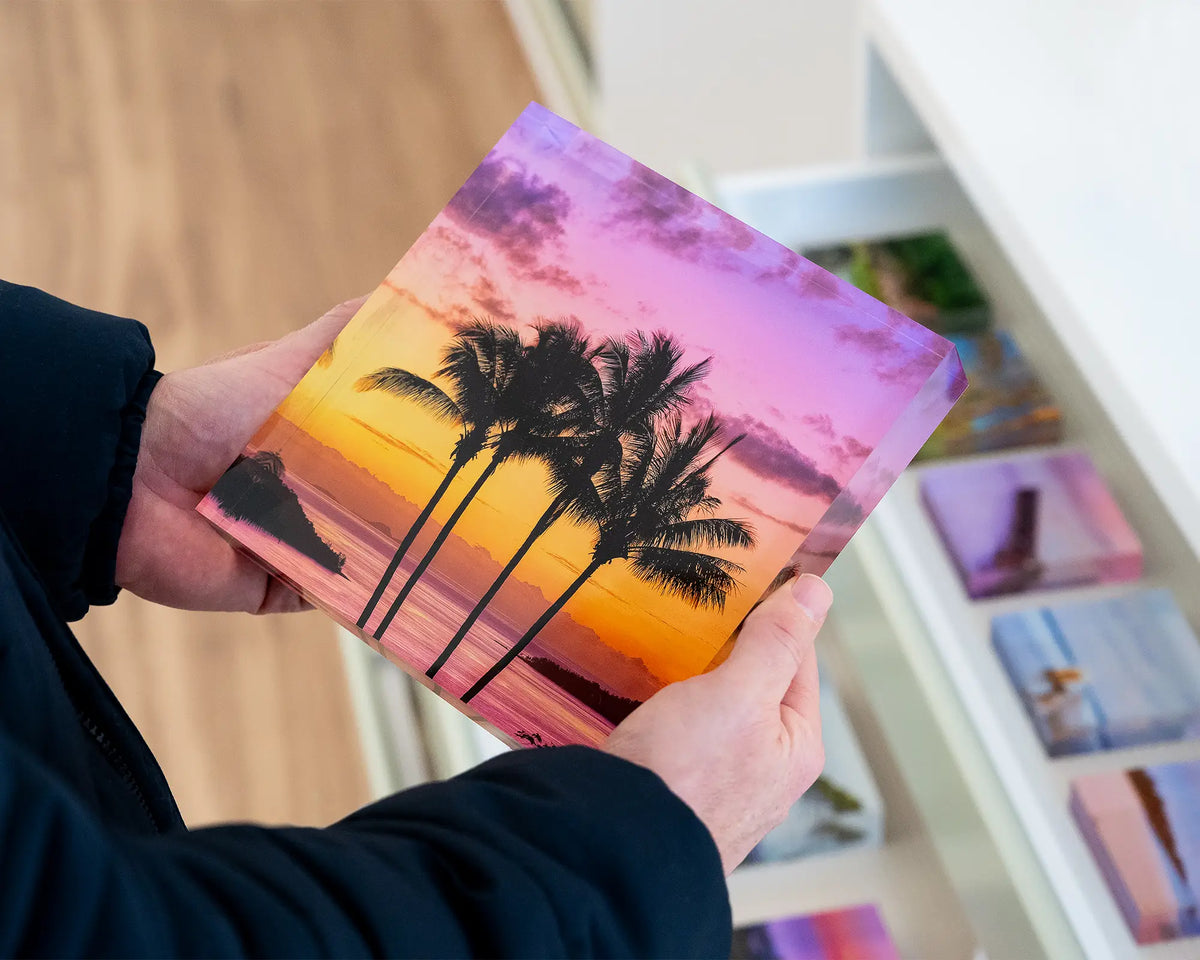 Getaway. Acrylic block of Palm trees at sunset, Hamilton Island Queensland, hand held over gallery display drawers.