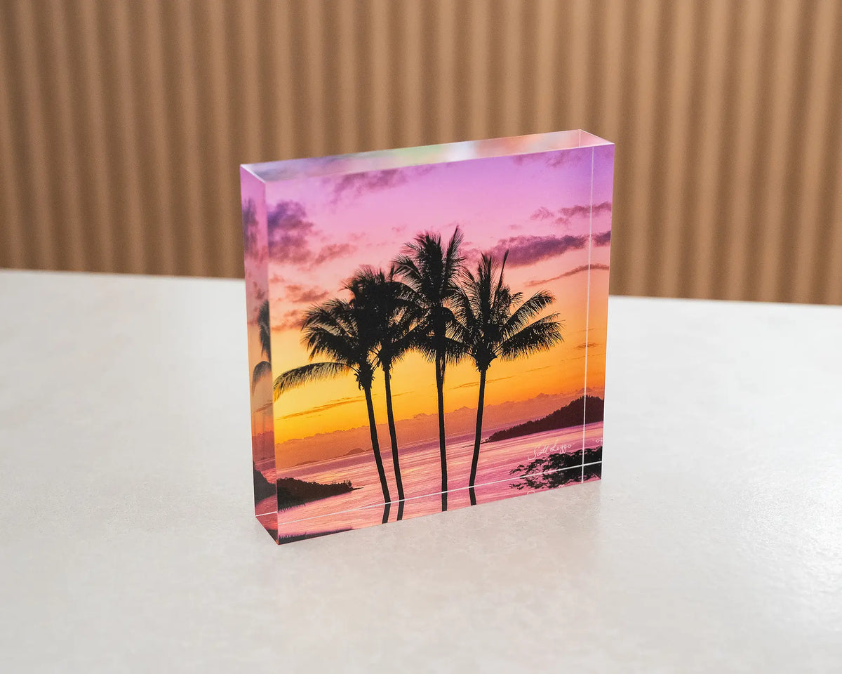 Getaway. Acrylic block of palm trees at sunset, Hamilton Island Queensland, sitting on a table.