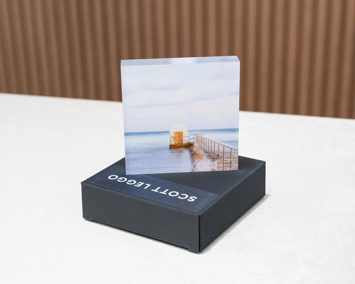 Golden Door. Acrylic block of dusk at Merewether Baths Newcastle, sitting on a gift box.