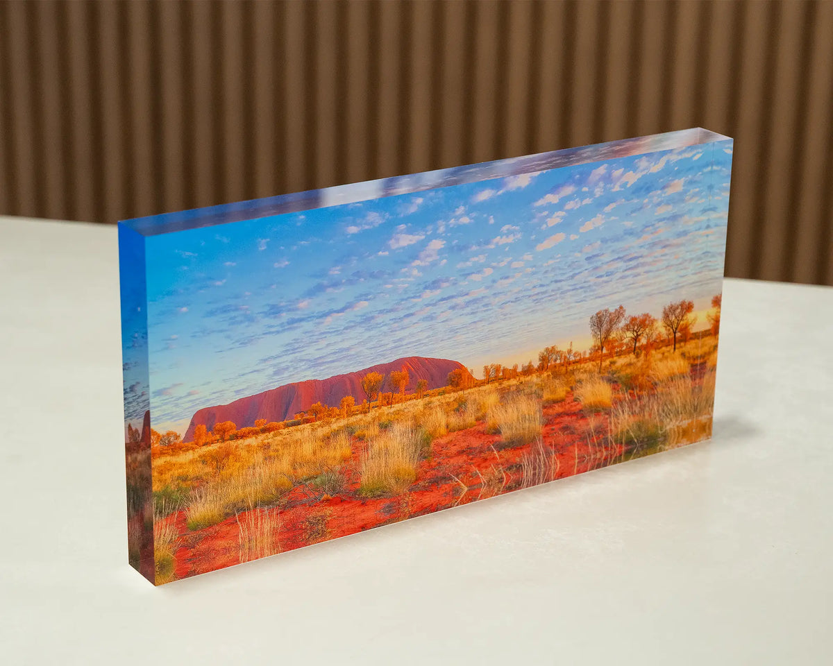 Great Southern Land. Acrylic block of Uluru, Northern Territory Australia, sitting on a desk.