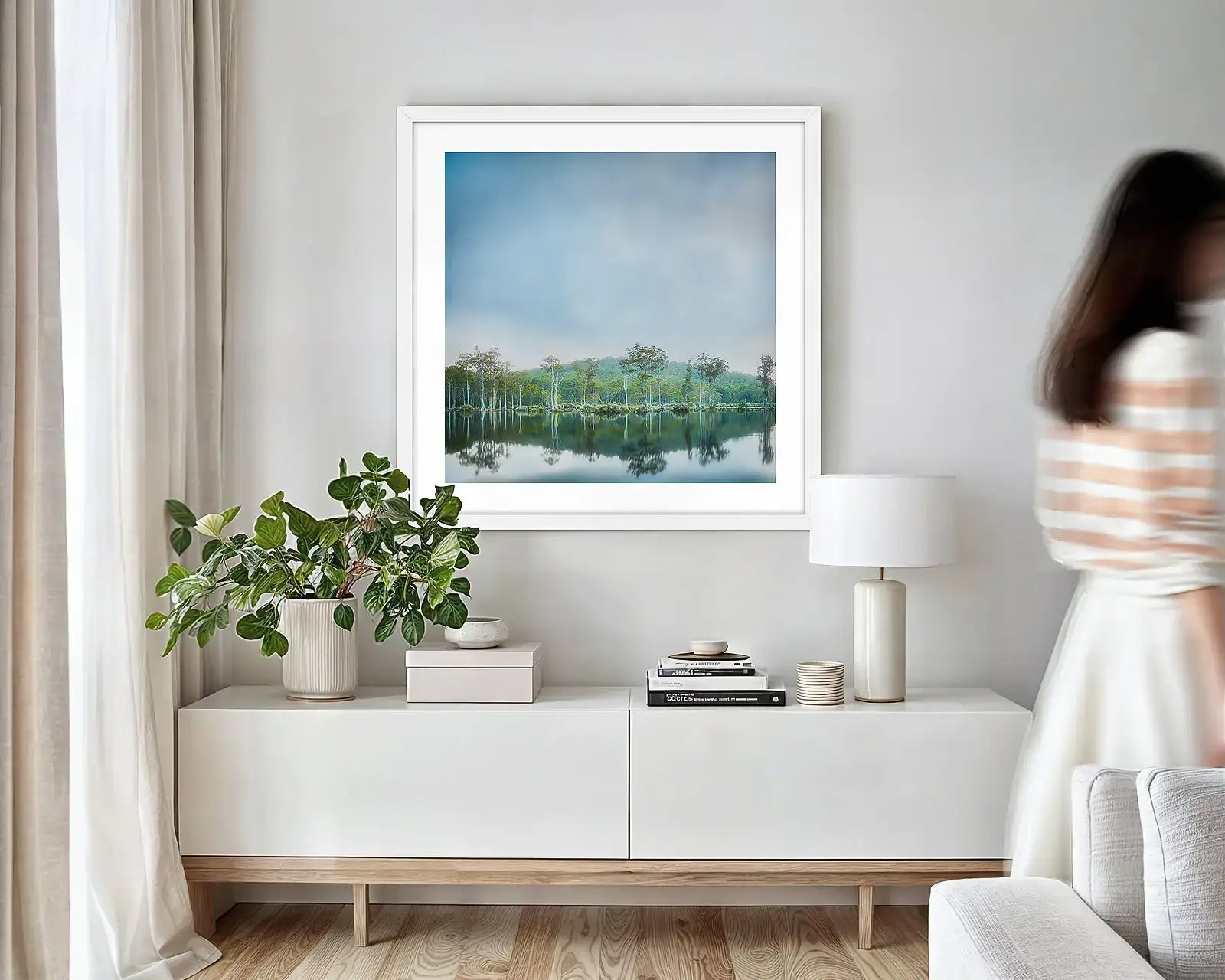 Green and blue Tasmanian wall art print hung in small lounge room.