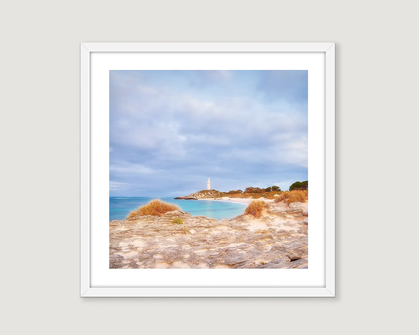 Framed artwork of a coastal landscape with a lighthouse at Rottnest Island. 