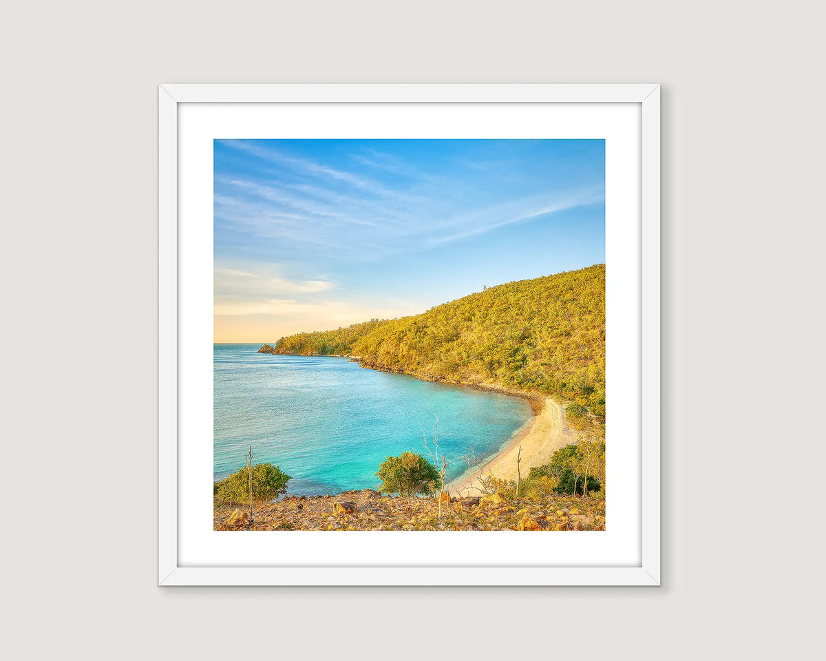 Framed wall art print of turquoise water and native bushland Hayman Island. 