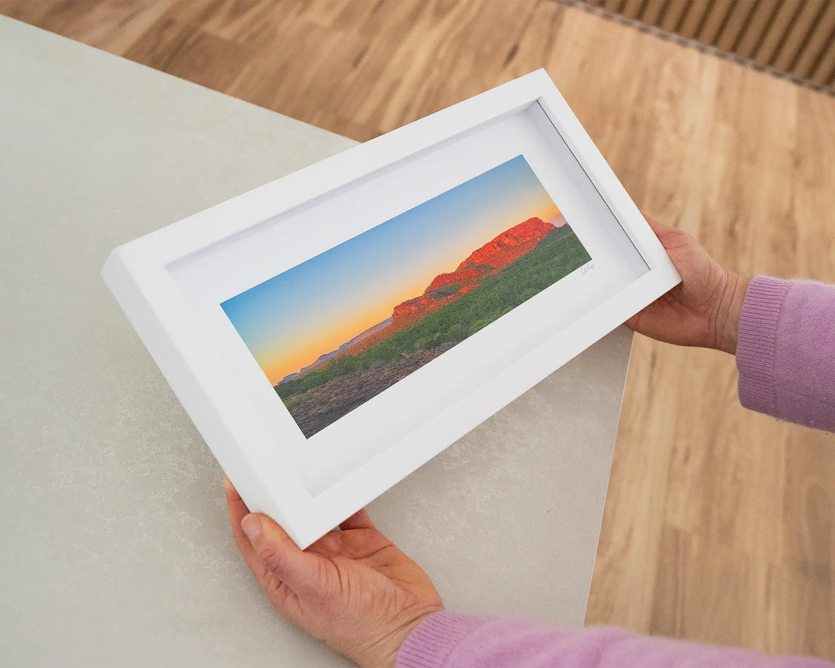 Heart Of Kakadu. Nourlangie Rock, Kakadu Naitonal Park, Northern territory, with white frame, held in hands.