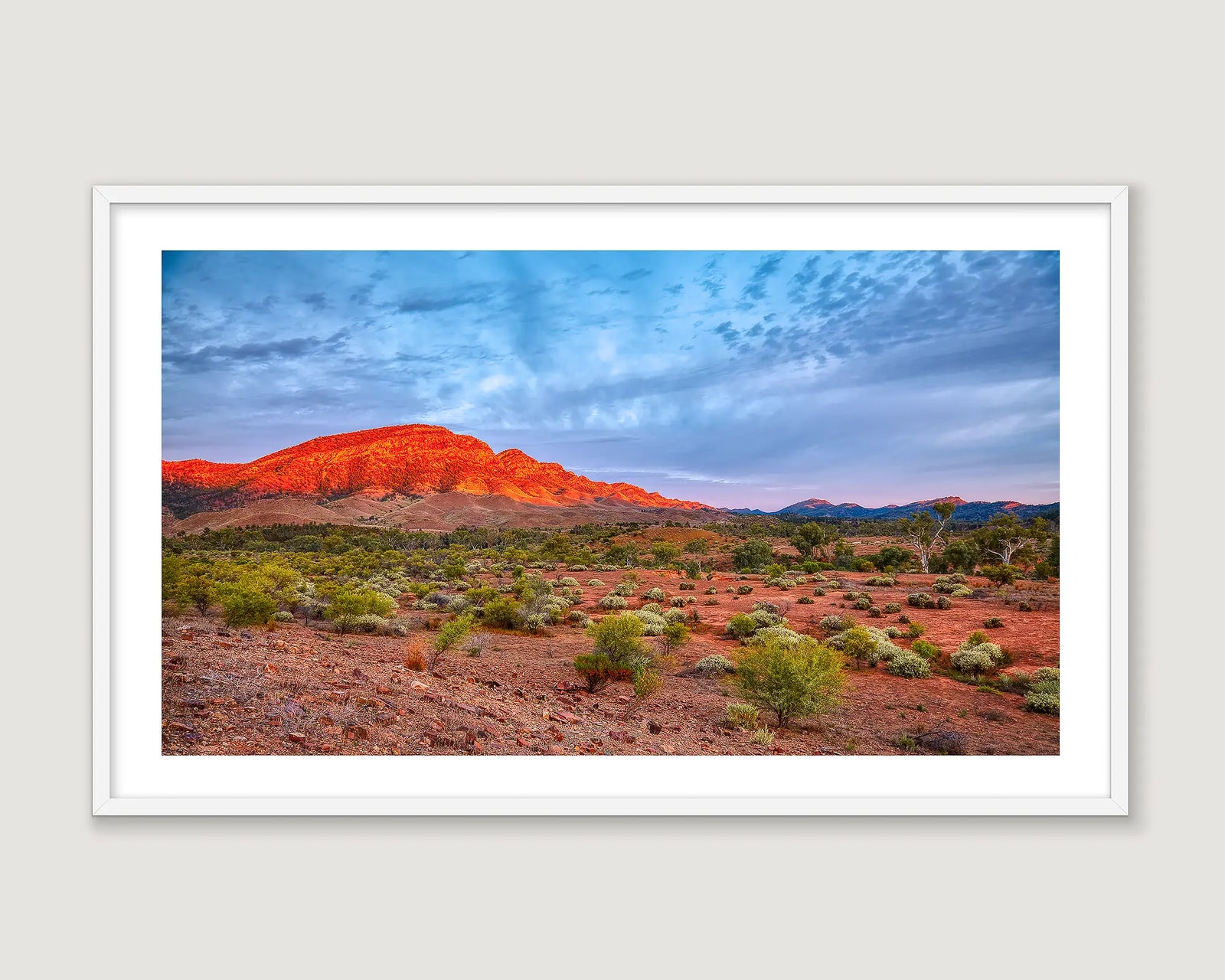 Framed wall art print of a sunset lighting up the Heysen Range. 