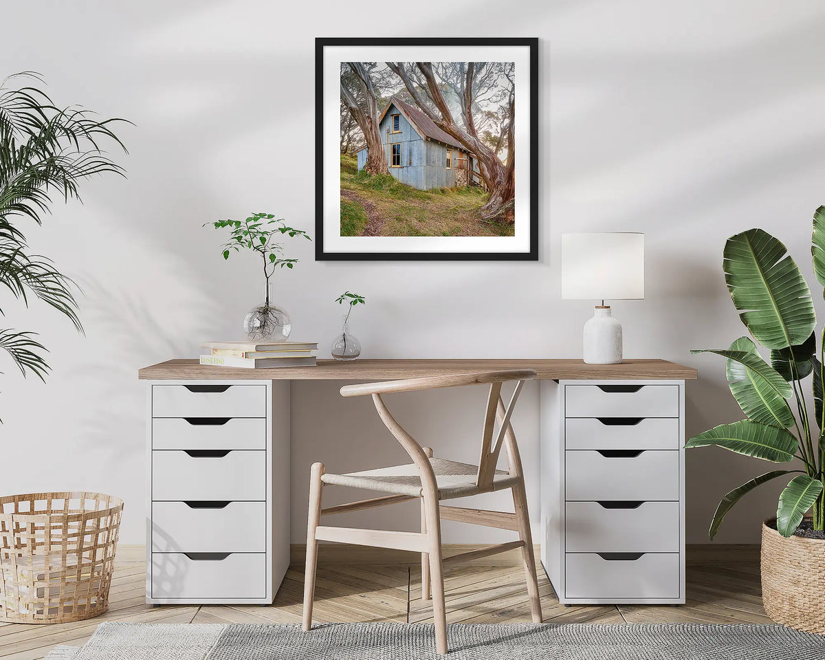High Country Life. Cope Hut, photographic wall art print with a black frame, hung in a home office. 