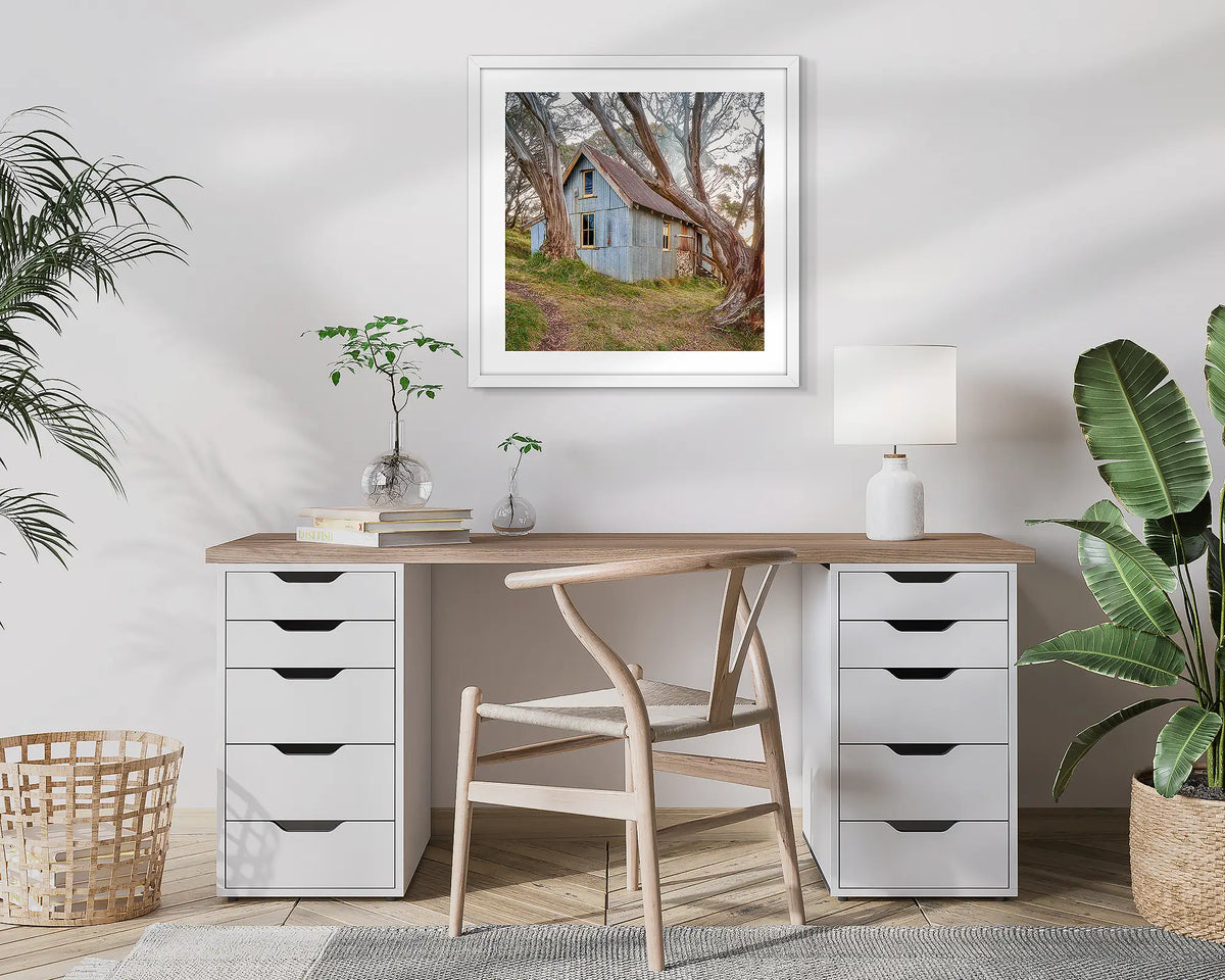 High Country Life. Cope Hut, photographic wall art print with a white frame, hung in a home office. 