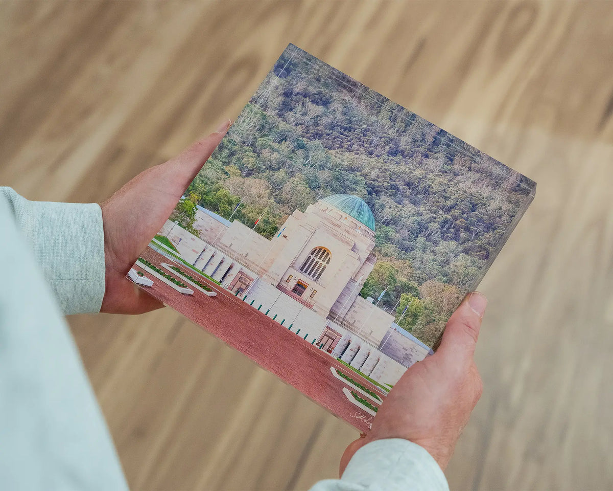 Honouring Their Spirit. 19cm acrylic block Australian War Memorial, Canberra, held in hands.