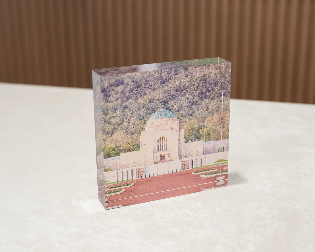 Honouring Their Spirit. Acrylic block of the Australian War Memorial, Canberra, sitting on a desk.