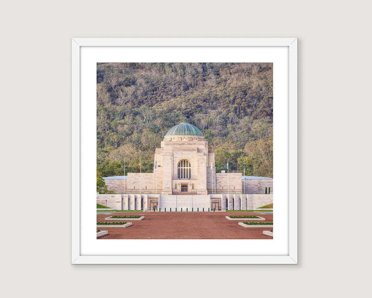 Framed photographic print of the Australian War Memorial with native bushland at the base of Mount Ainslie. 