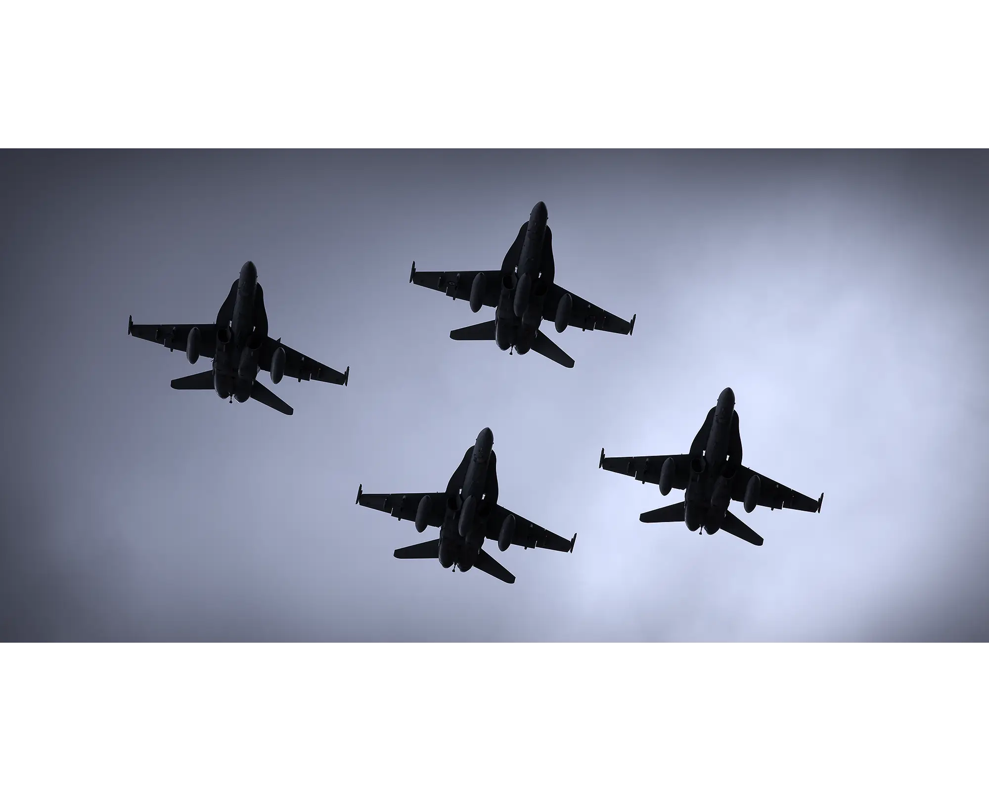 Australian Air Force F-18 Hornets flying in diamond formation.