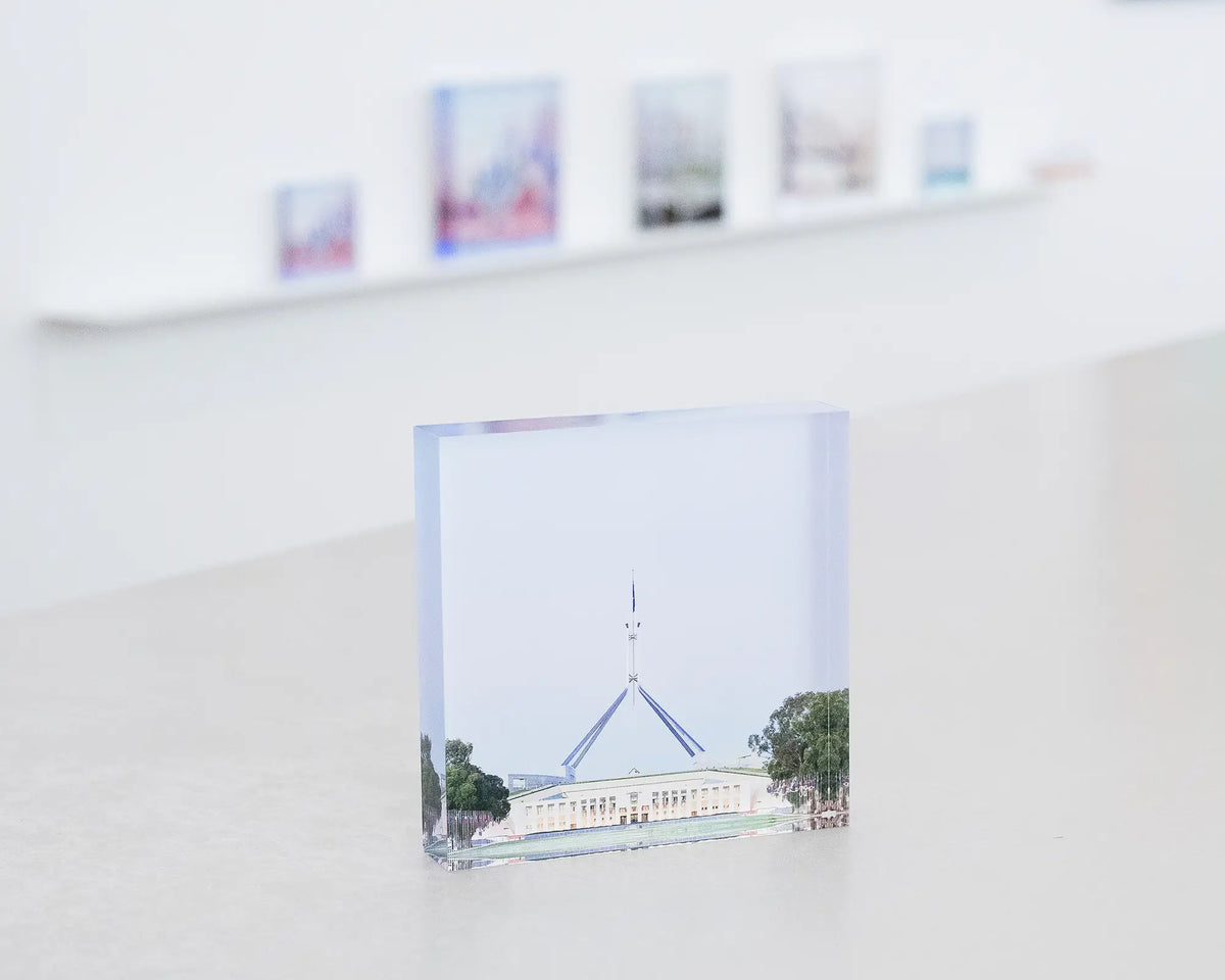 House On The Hill. Acrylic block of Parliament House, Canberra, on gallery desk.