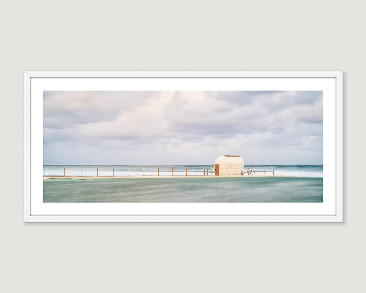 Framed coastal wall art of the pumphouse at Merewether Ocean Baths. 