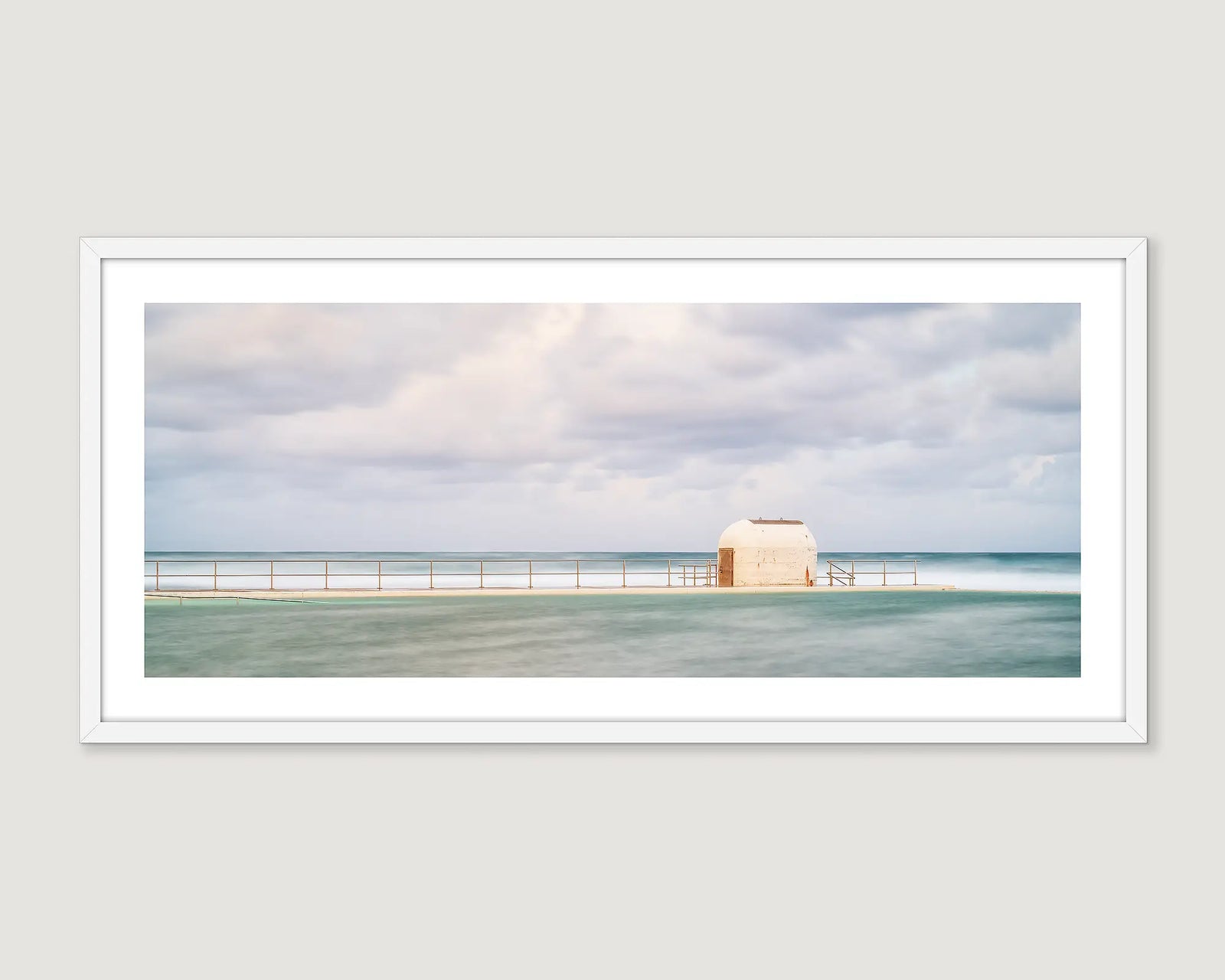 Framed coastal wall art of the pumphouse at Merewether Ocean Baths. 