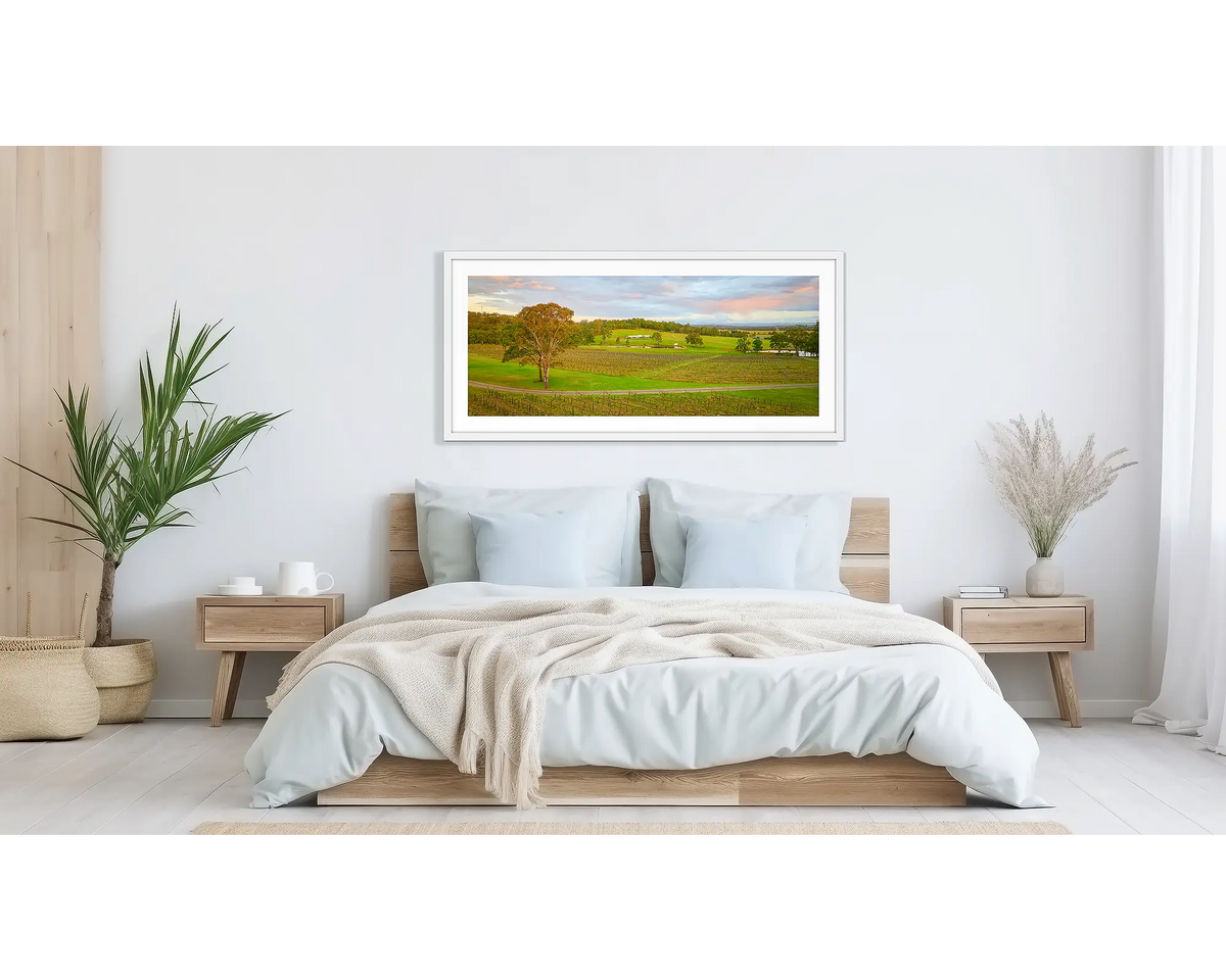 Hunter Valley Retreat. Wall art print of Molly Morgan winery with white frame, hung above bed.