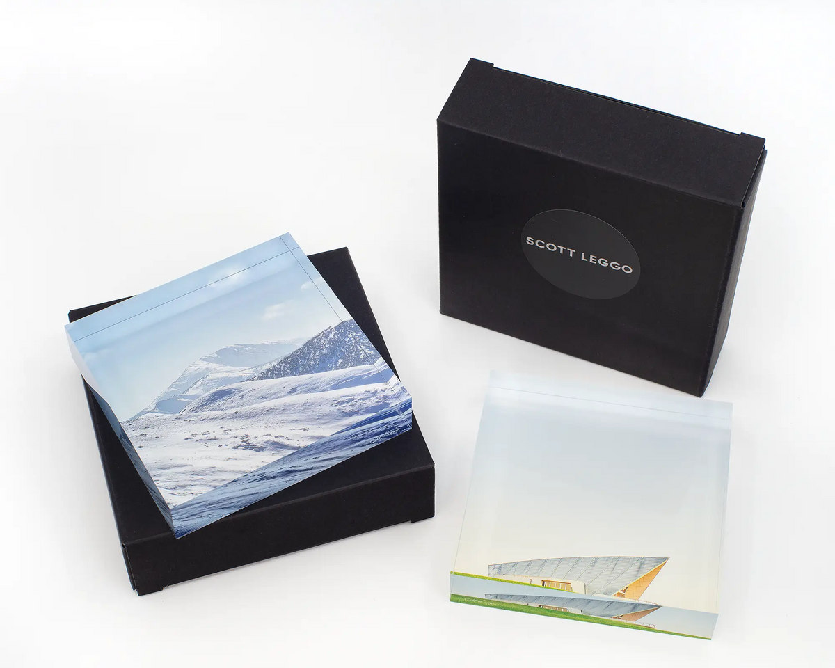 Icon of the Alps acrylic block with another acrylic block and gift boxes. 