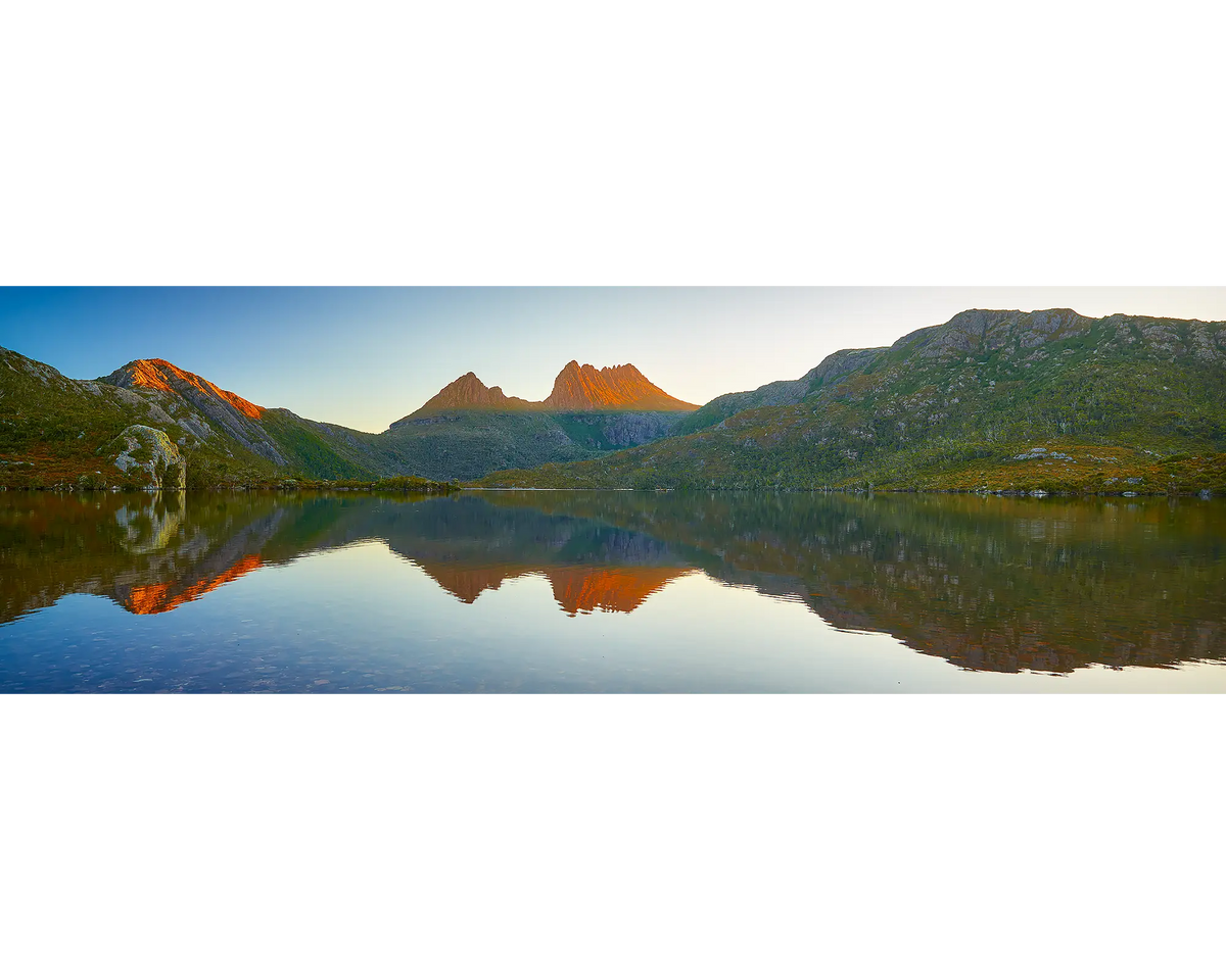 Illumination. Sunset reflection of Cradle Mountain in Dove Lake, Tasmania, Australia.