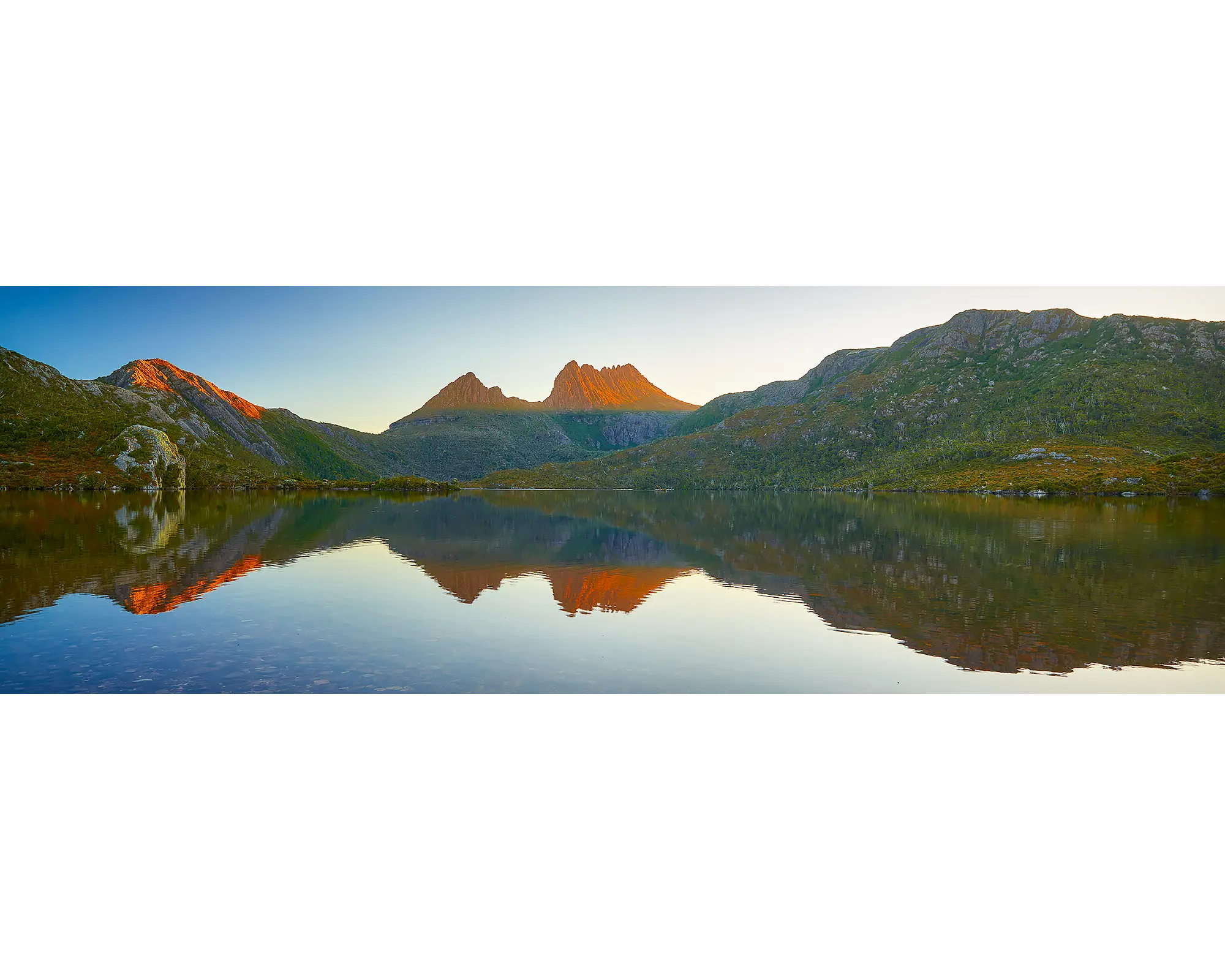 Illumination. Sunset reflection of Cradle Mountain in Dove Lake, Tasmania, Australia.