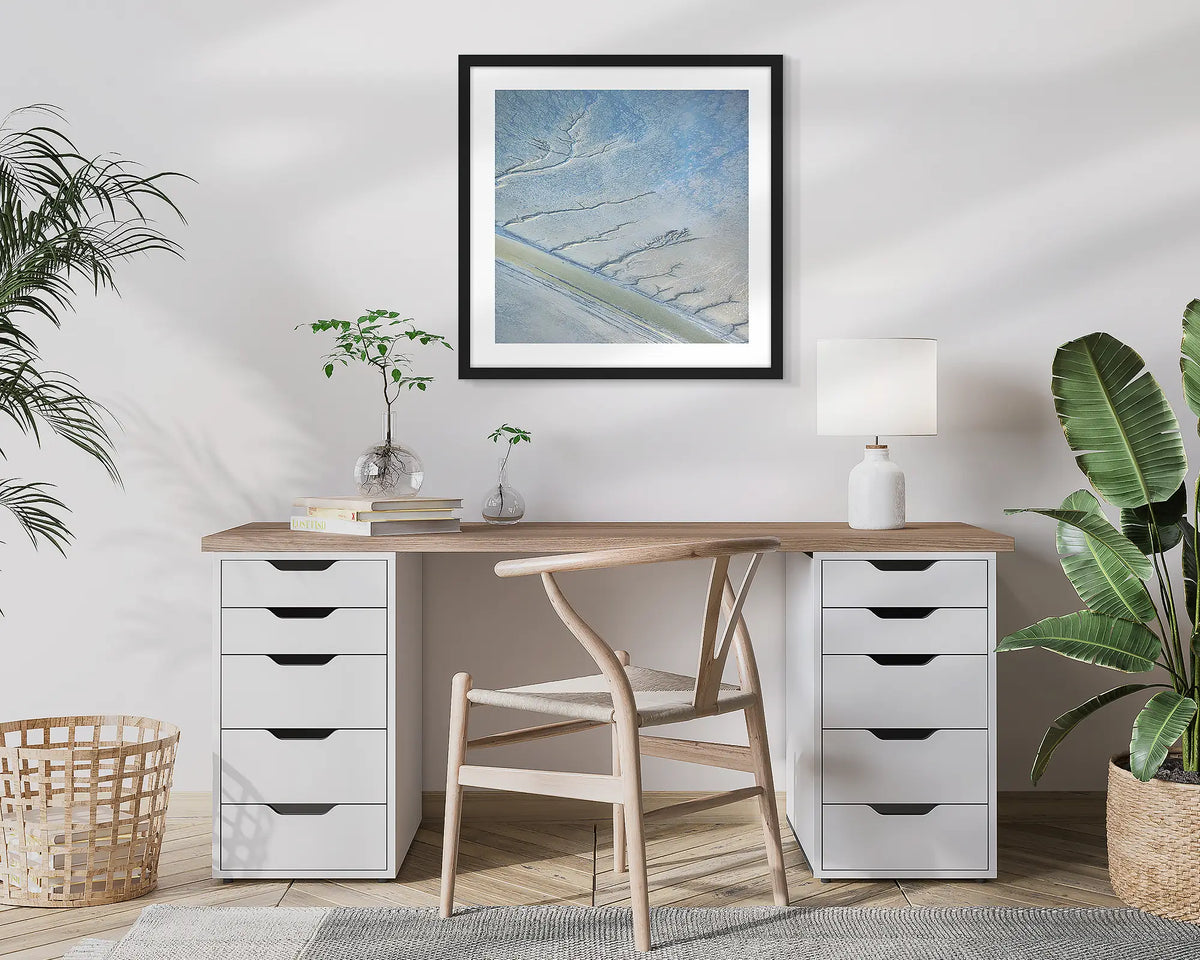Increment. Aerial, abstract photographic wall art print with a black frame, hung in a home office. 