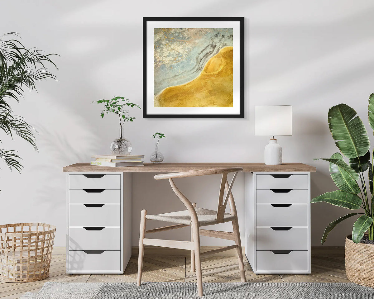 Interchange. Aerial, abstract photographic wall art print with a black frame, hung in a home office. 