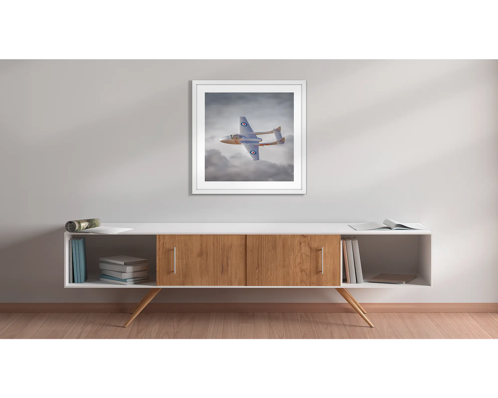 De Havilland Vampire in Royal New Zealand Air Force colours , flying against backdrop of clouds.