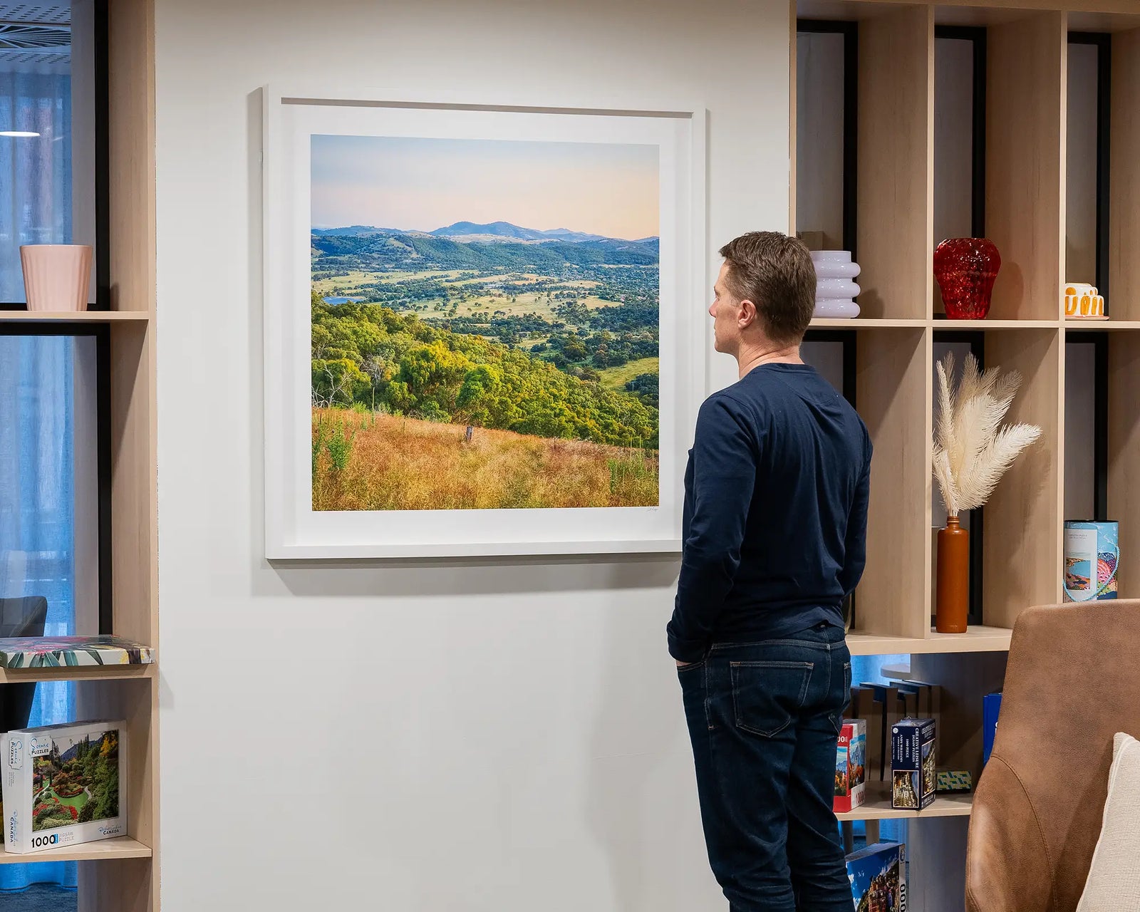 Framed print of a scenic landscape of southern Canberra with green hills and mountains.