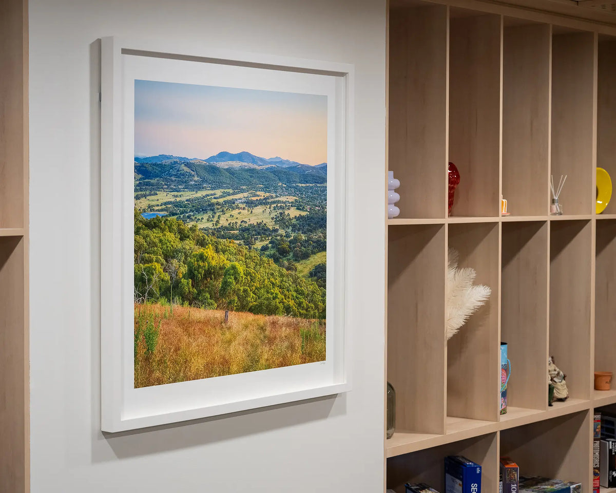 Isaacs Views. Sunset from Isaacs Ridge, Canberra, with white frame, hung in living area.