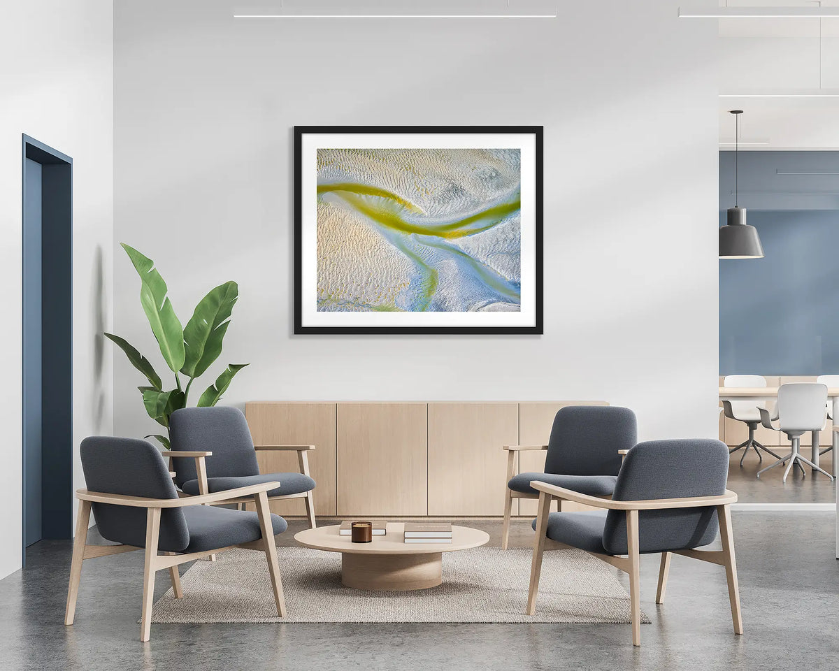 Jellyfish. Abstract wall art print with a black frame, hung on the wall of a waiting area.