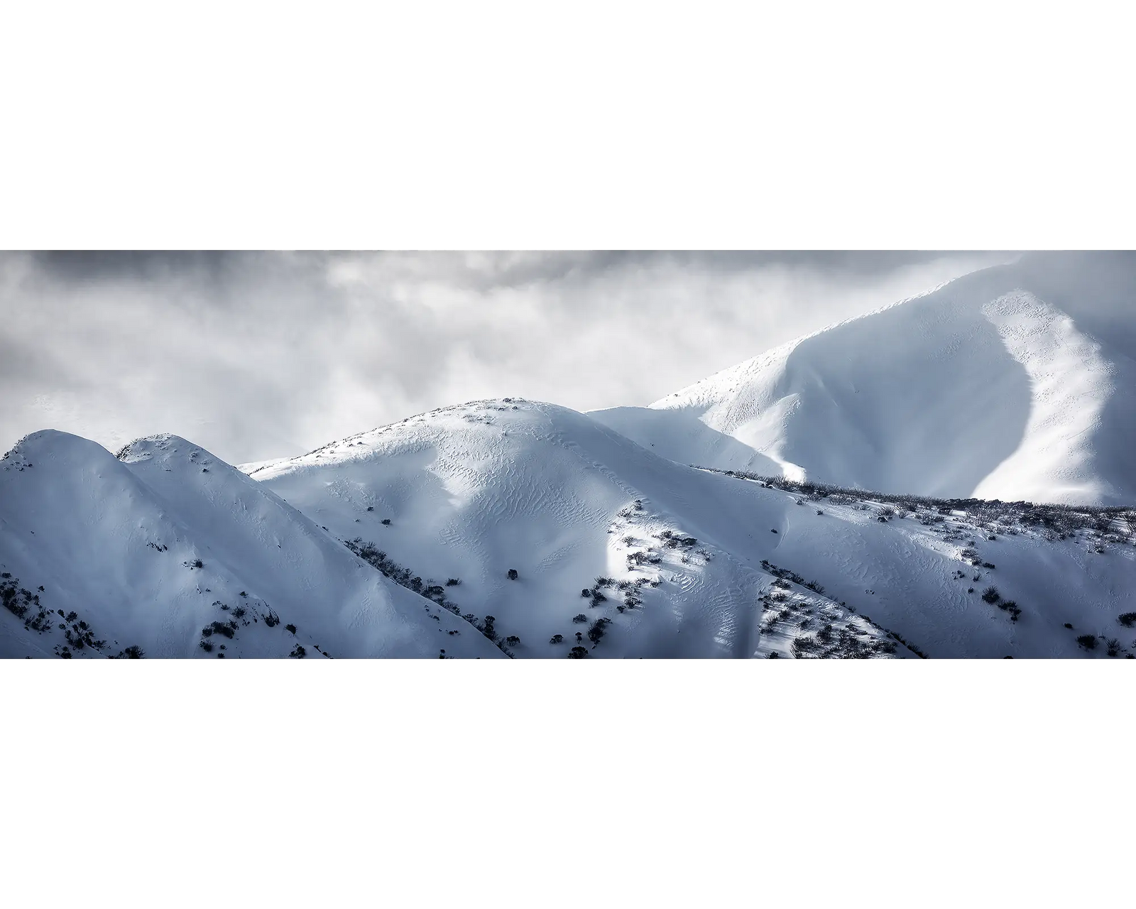 Clouds lingering above the Razorback and Mount Feathertop, Alpine National Park, Victoria. 