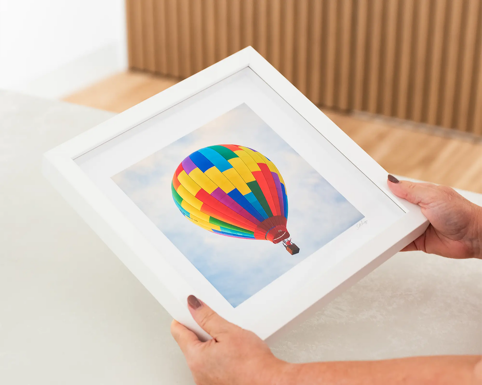Framed wall art print of a colorful hot air balloon at the Balloon Spectacular Festival, Canberra. 