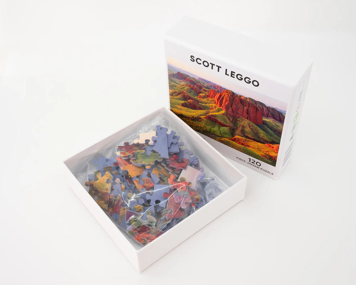 Kimberley Spirit 120 piece jigsaw puzzle box open with puzzle pieces inside.