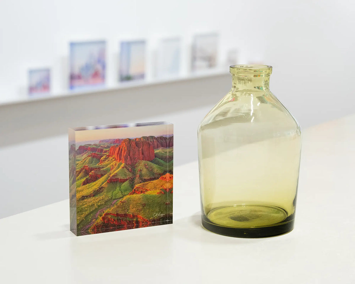 Kimberley Spirit. Acrylic block of Ragged Range, The Kimberley, on gallery desk styled with a small vase.